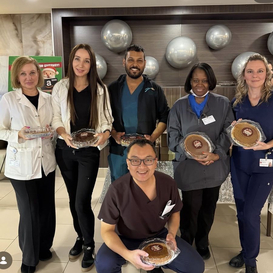 Acclaim staff celebrating with holiday treats