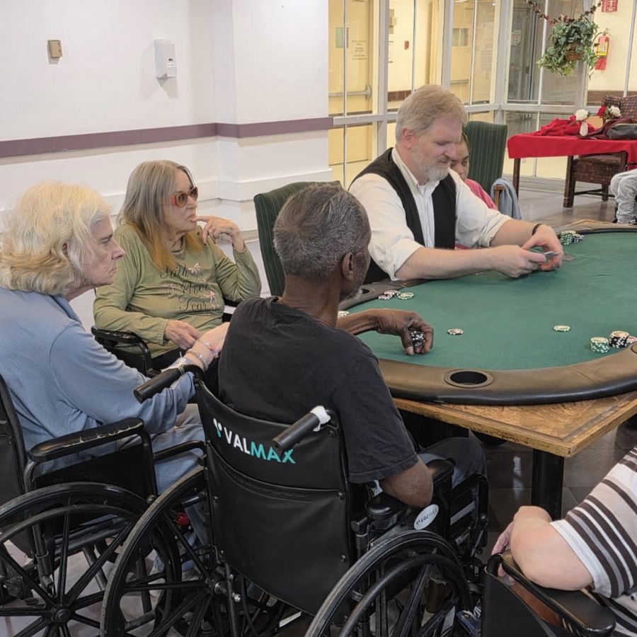 Residents enjoying a competitive poker night